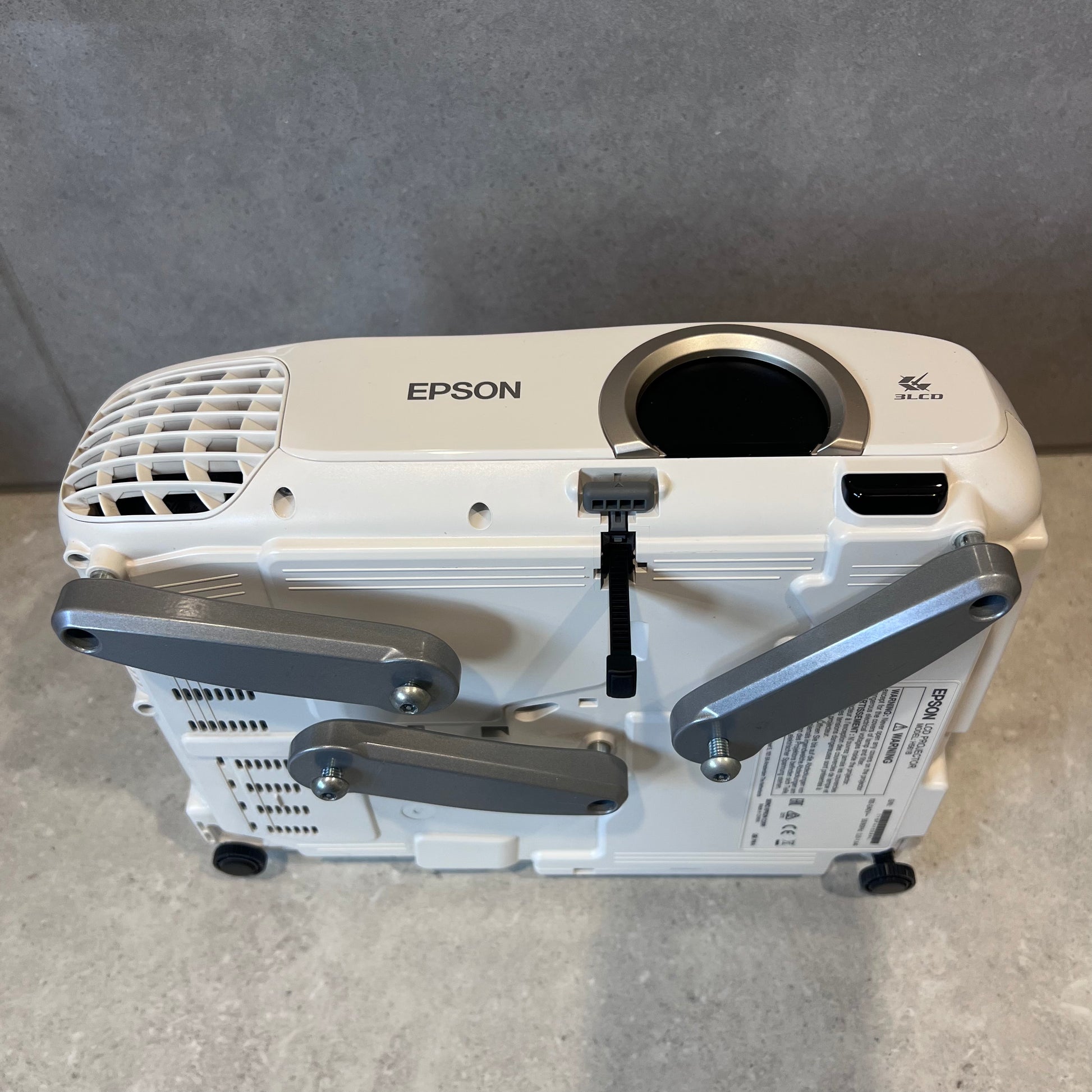 Bottom alternate angle of Epson EH-TW5200 projector displaying adjustable feet and mounting points